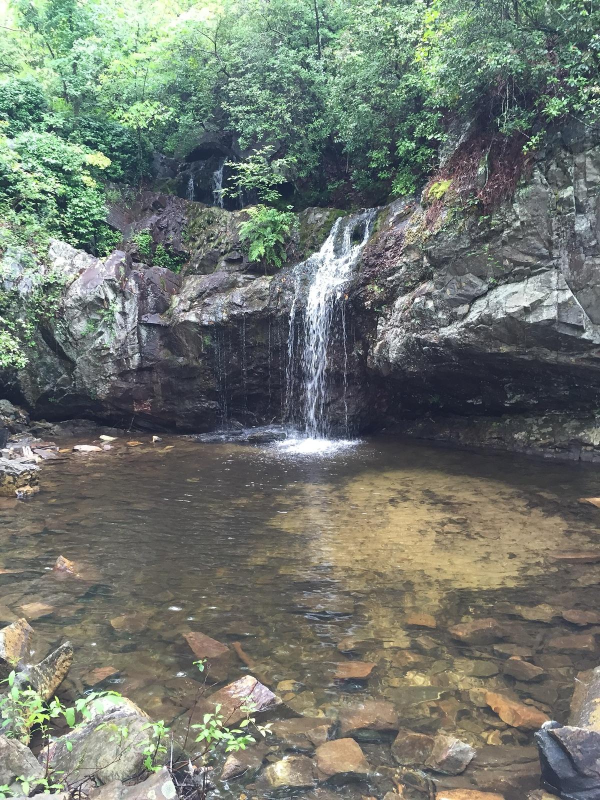 Waterfall and clear rock pool on a creek in the Talladega National Forest, Cleburne County, Alabama