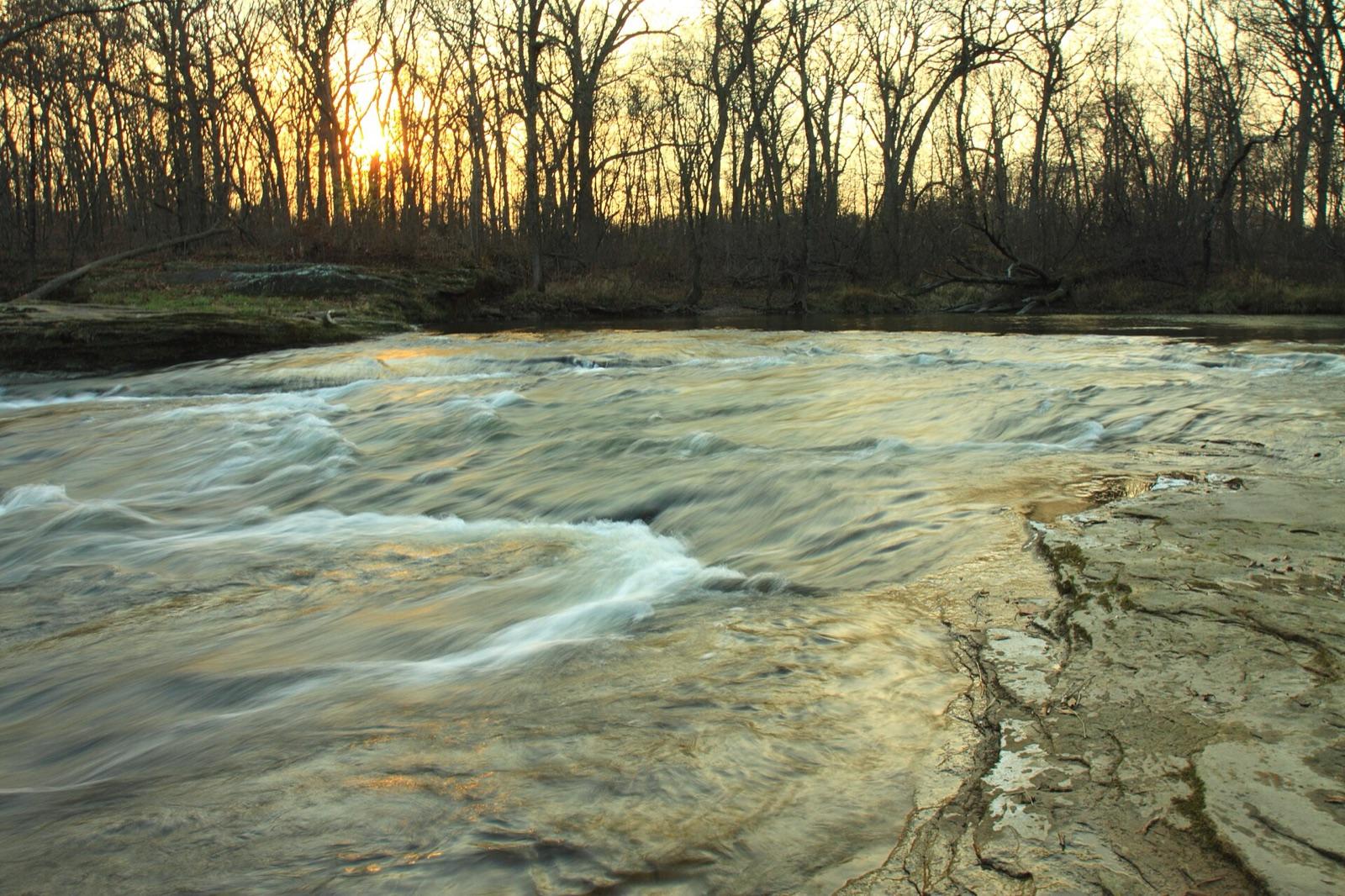 Big Pine Creek flowing over rock ledges at sunset, Warren County, Indiana.