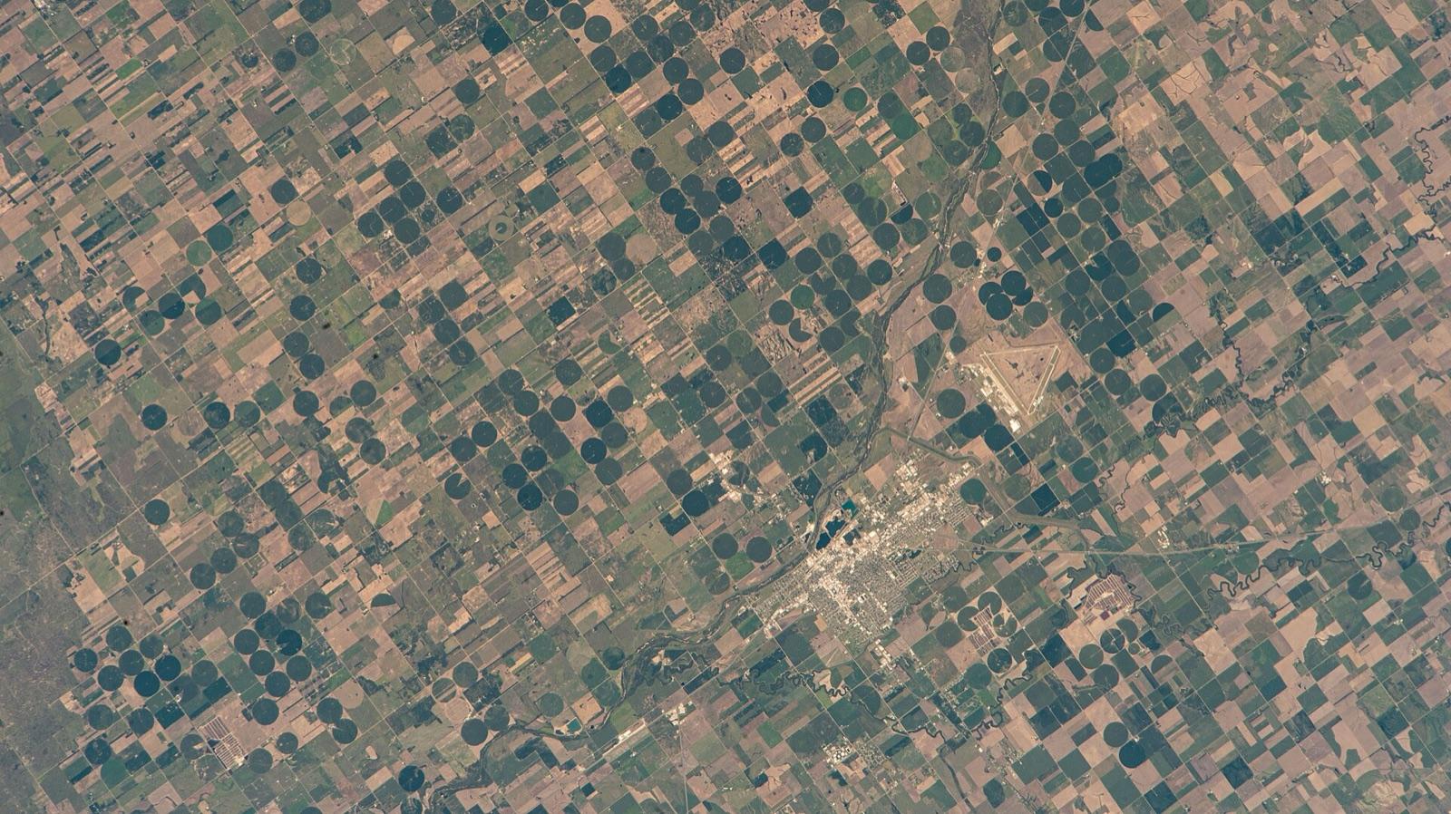 Aerial view of the Arkansas River winding past Great Bend, Barton County, Kansas, seen from the International Space Station