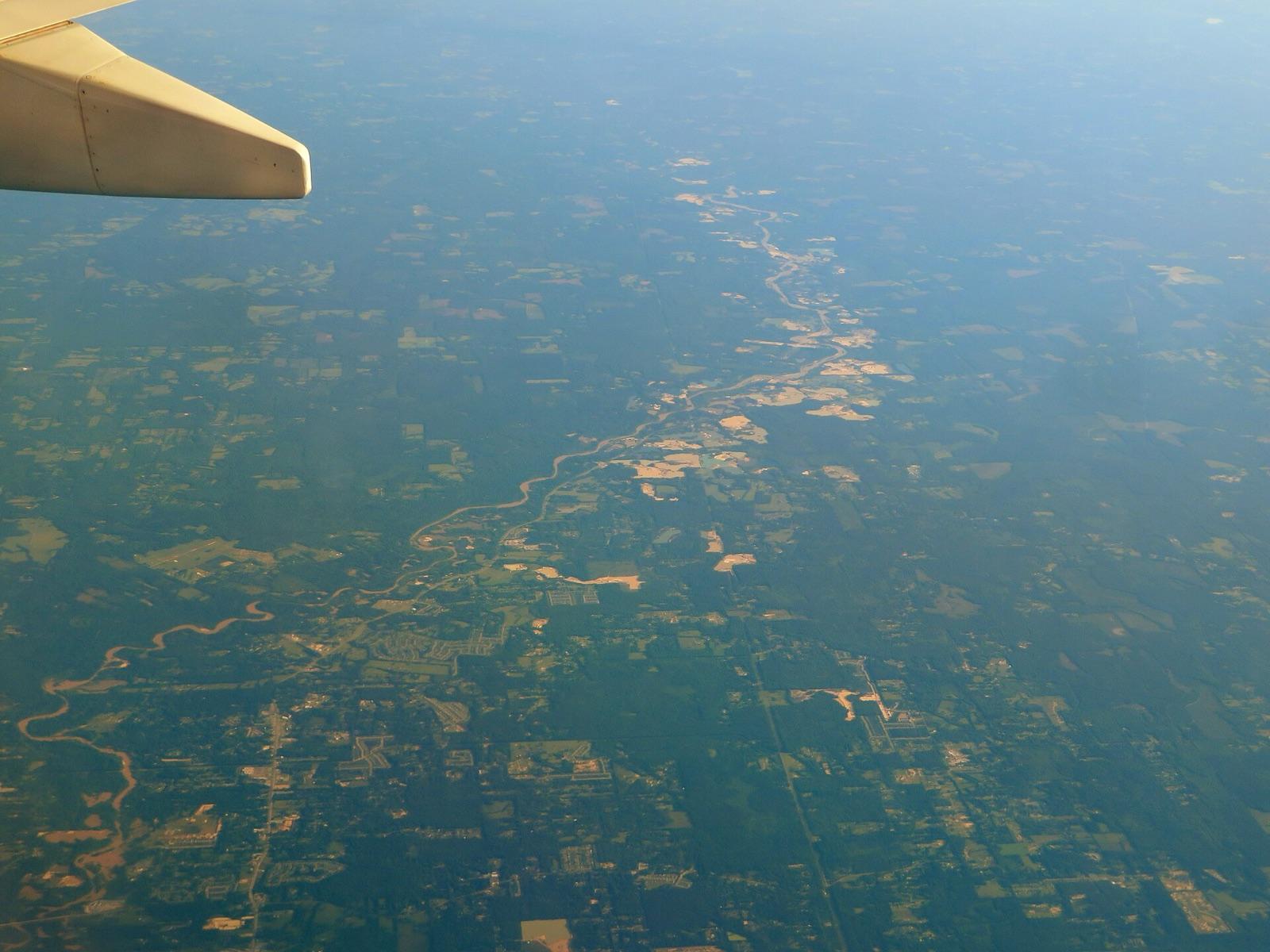 Aerial view of the Amite River north of Baton Rouge, Louisiana, with gravel workings along its course