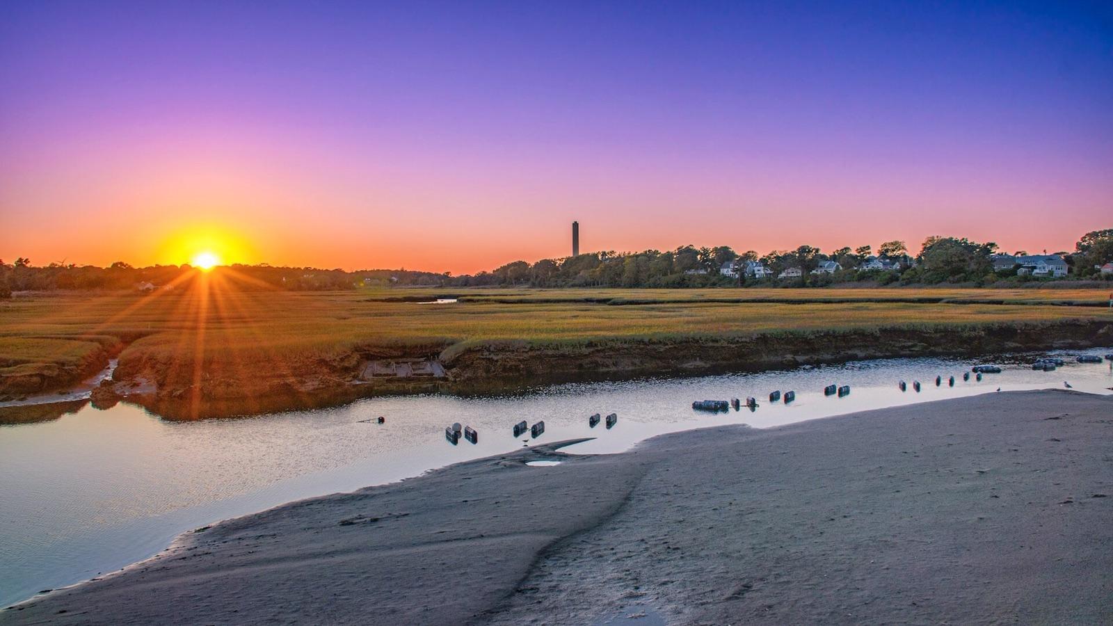 Sunset over the salt marsh at the Sandwich boardwalk leading to Town Neck Beach, Barnstable County, Massachusetts