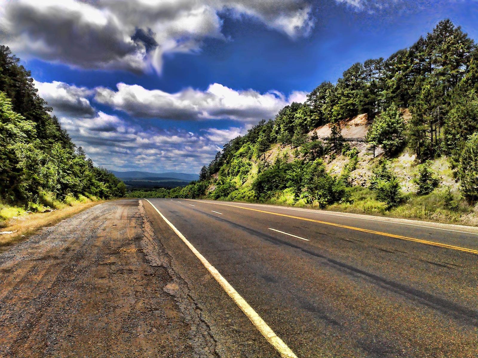 The forested Ouachita Mountains and a road cut along the Talimena route in the Ouachita National Forest, Le Flore County, Oklahoma