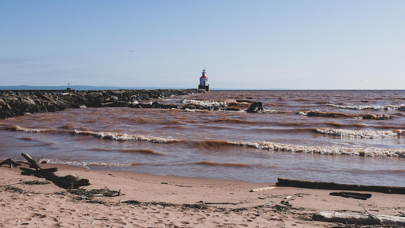 Sand beach and breakwater lighthouse at Wisconsin Point, Superior, on Lake Superior