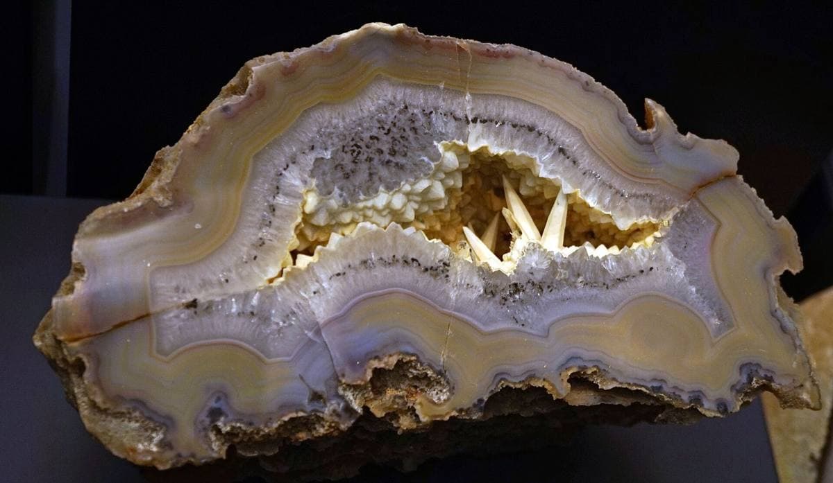 Blue-grey banded agate geode with a crystal-lined centre
