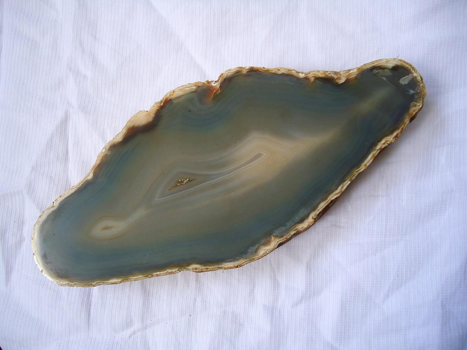 Sectioned Brazilian agate slab with concentric banding