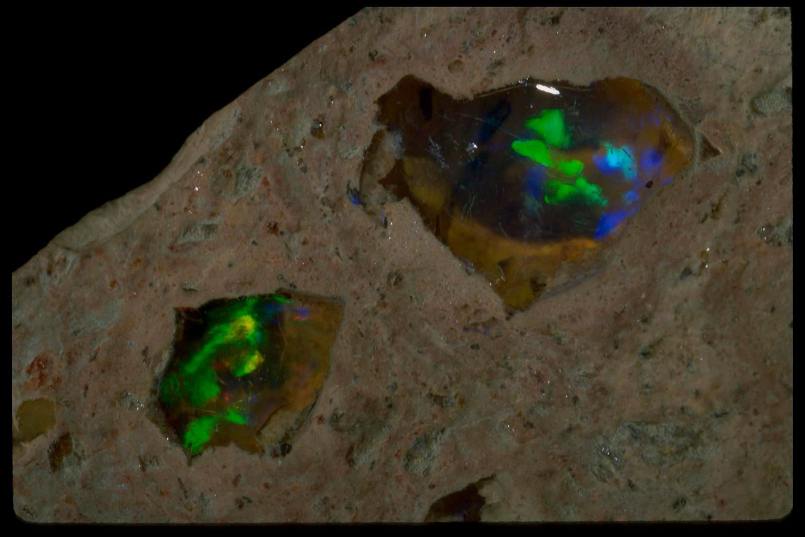 Close view of opal pockets with green and blue play of color in host rock, Querétaro, Mexico