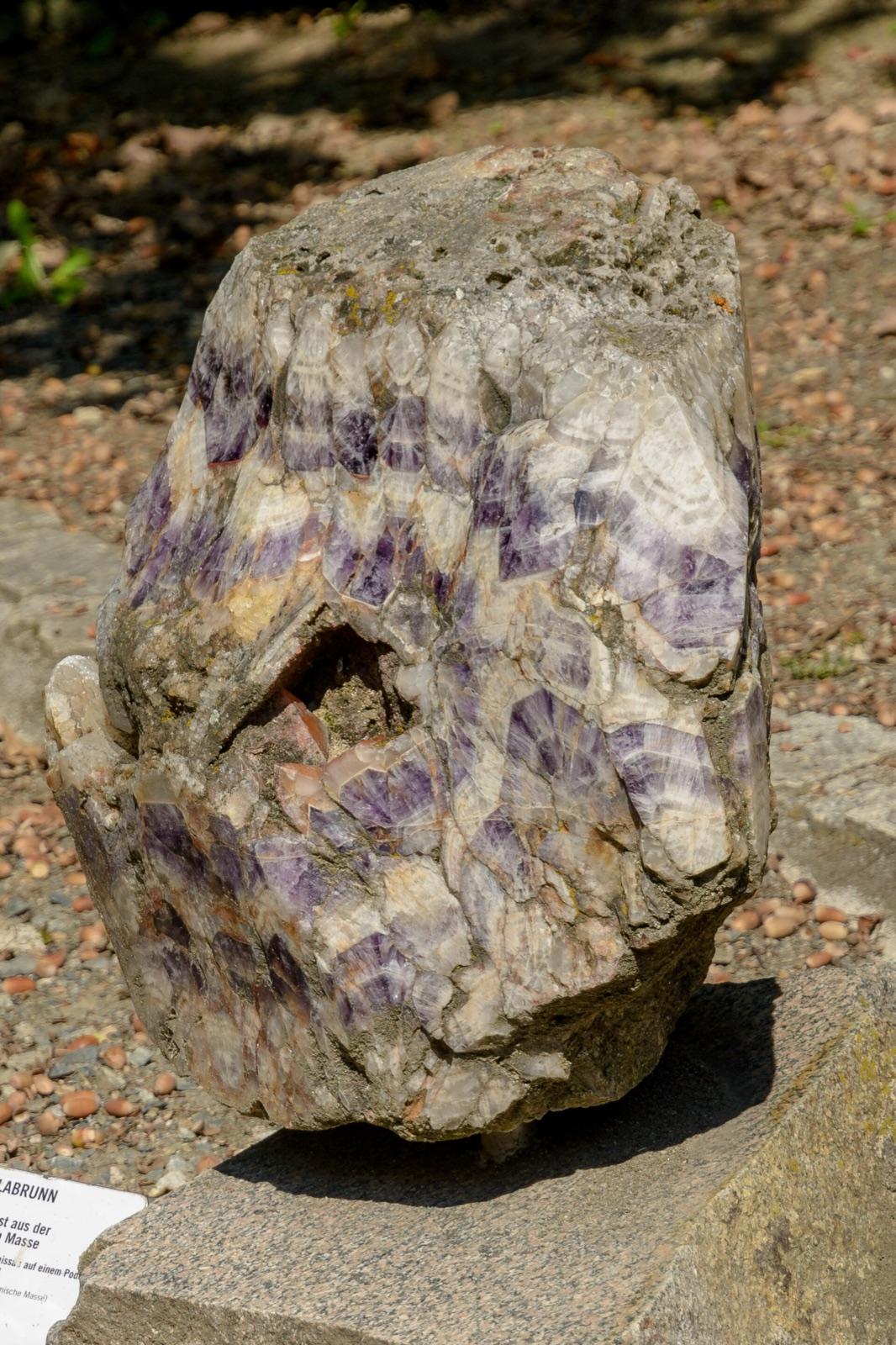 Large block of chevron (banded) amethyst on outdoor display at Maissau, Austria