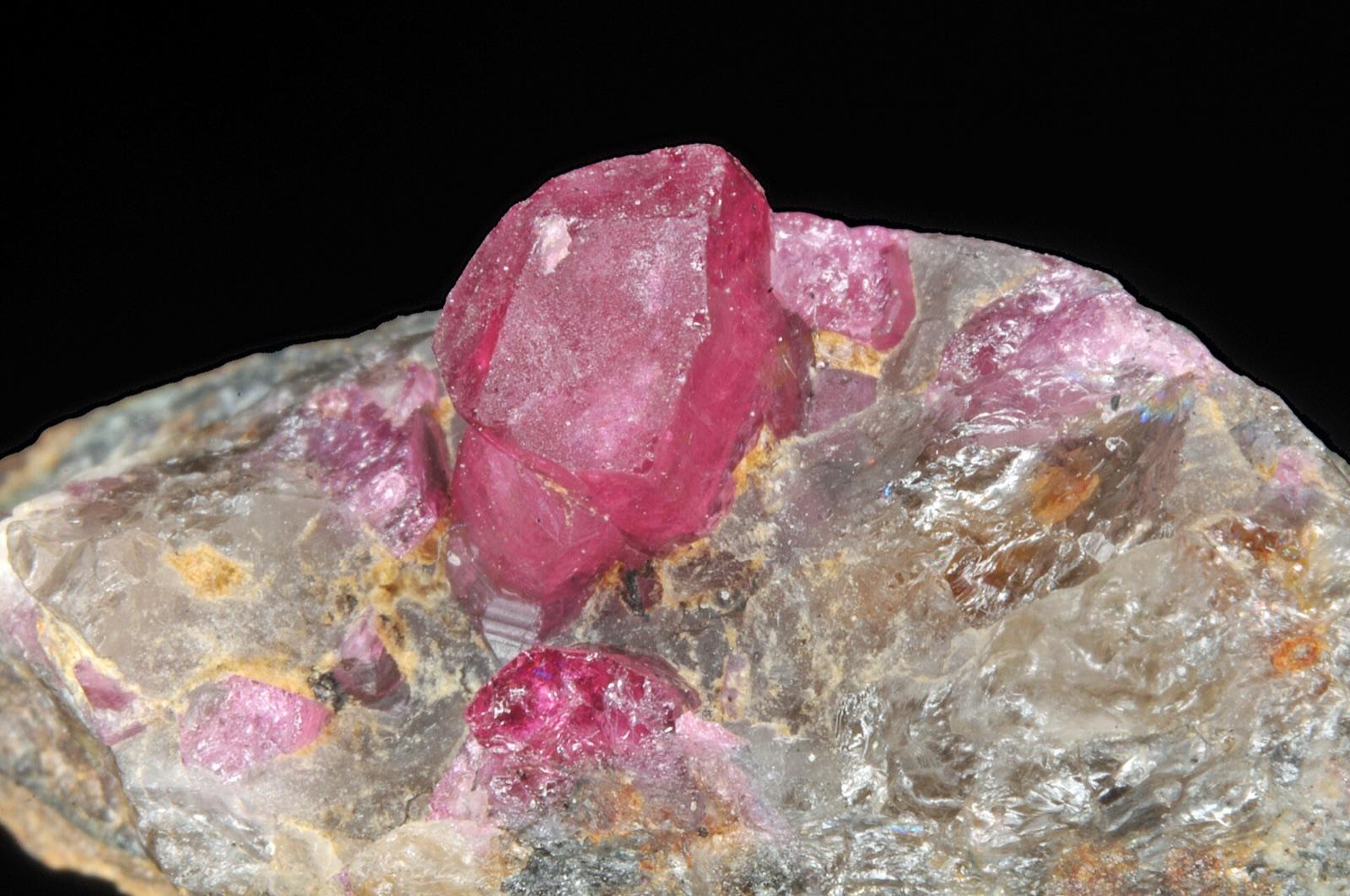 Pink liddicoatite crystal on quartz