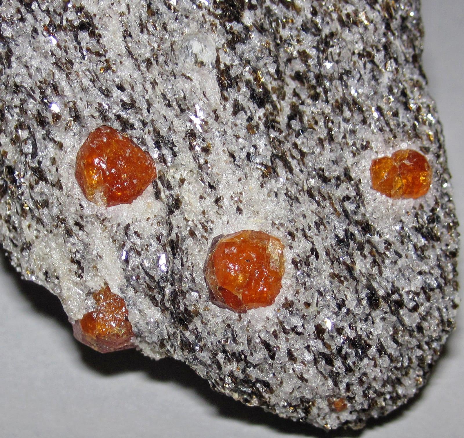Mandarin Garnet gemstone, Orange spessartine garnets in schist (Outomongu Mine, Namibia)