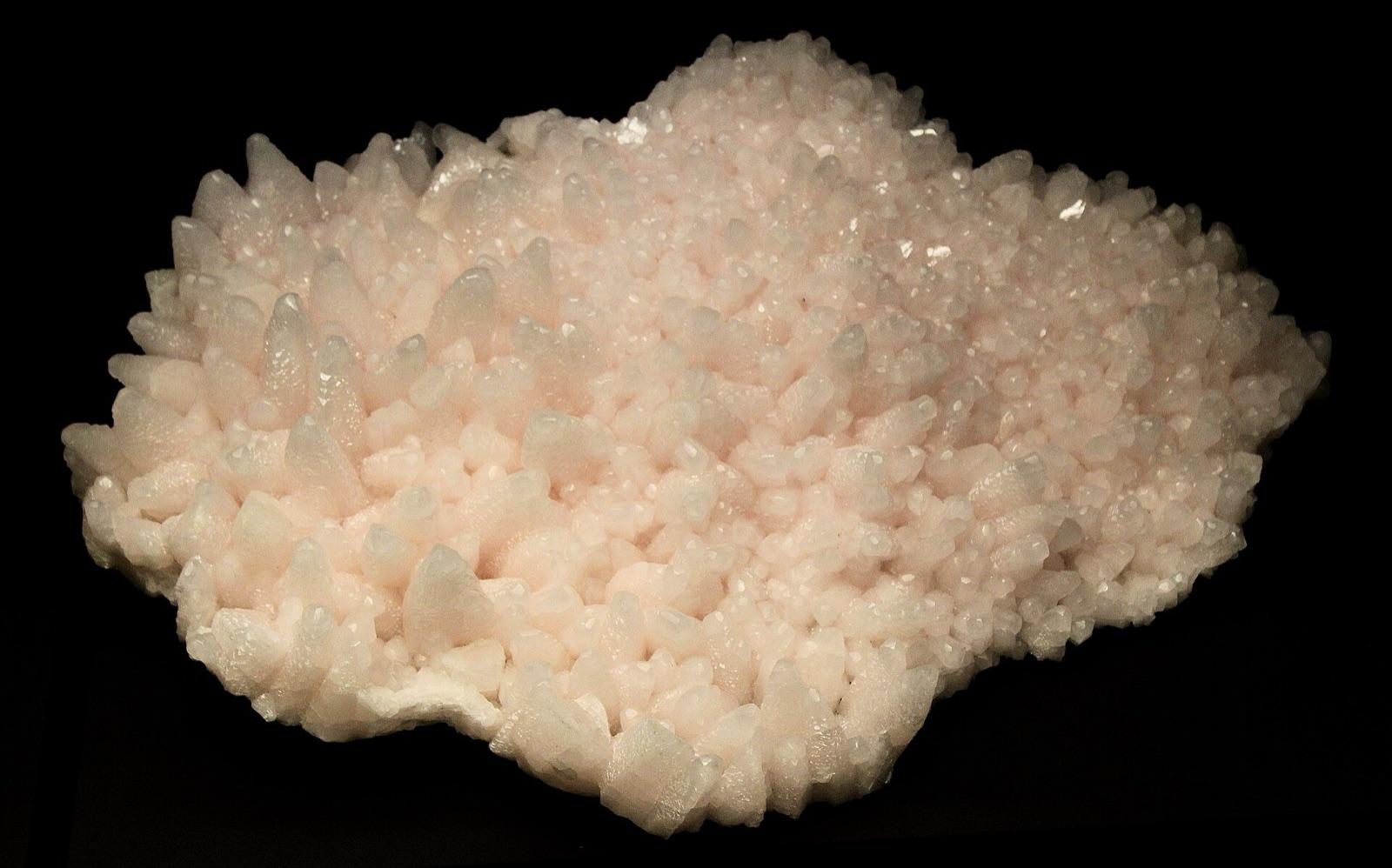 Pale pink manganocalcite crystal cluster from the Rhodope Mountains, Bulgaria