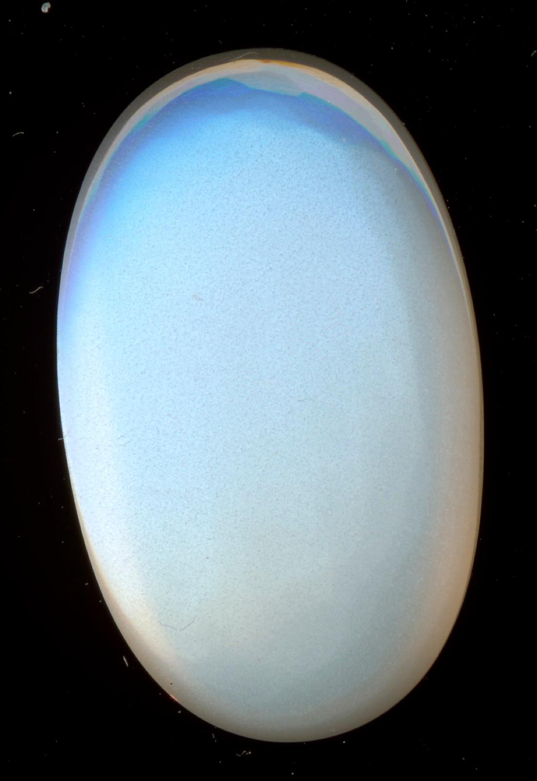 Moonstone cabochon from Meetiyagoda, Sri Lanka, with a soft blue glow