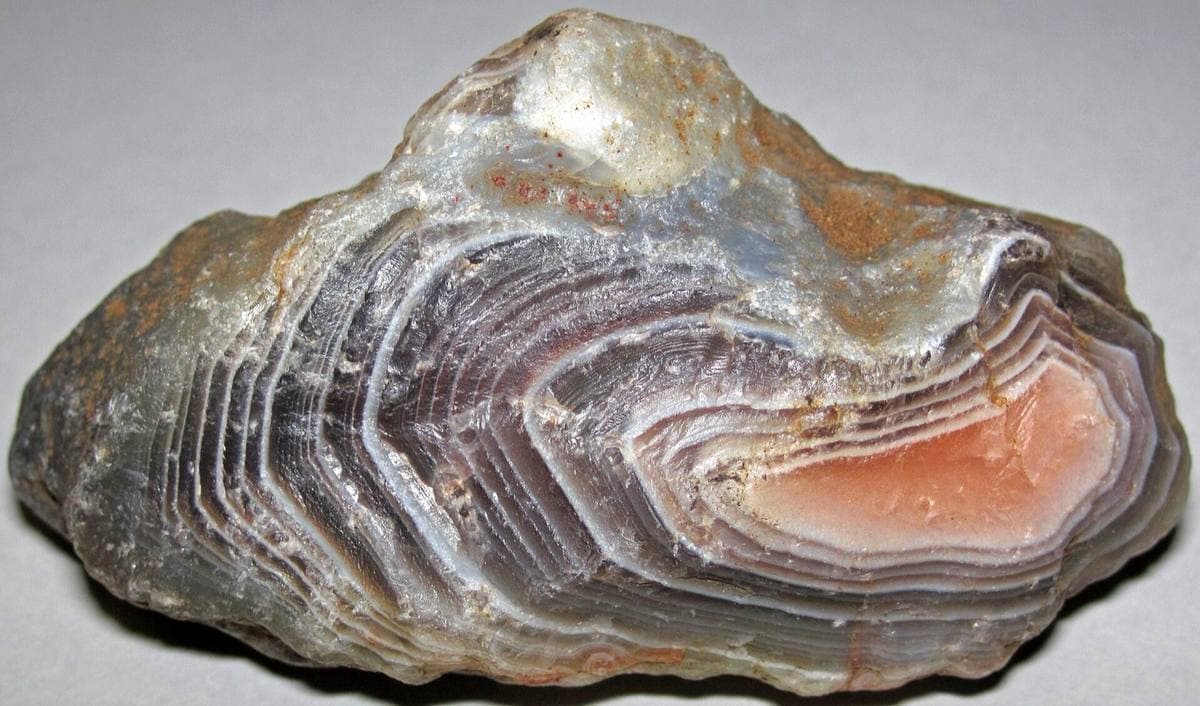 Grey agate with a rose-pink banded zone