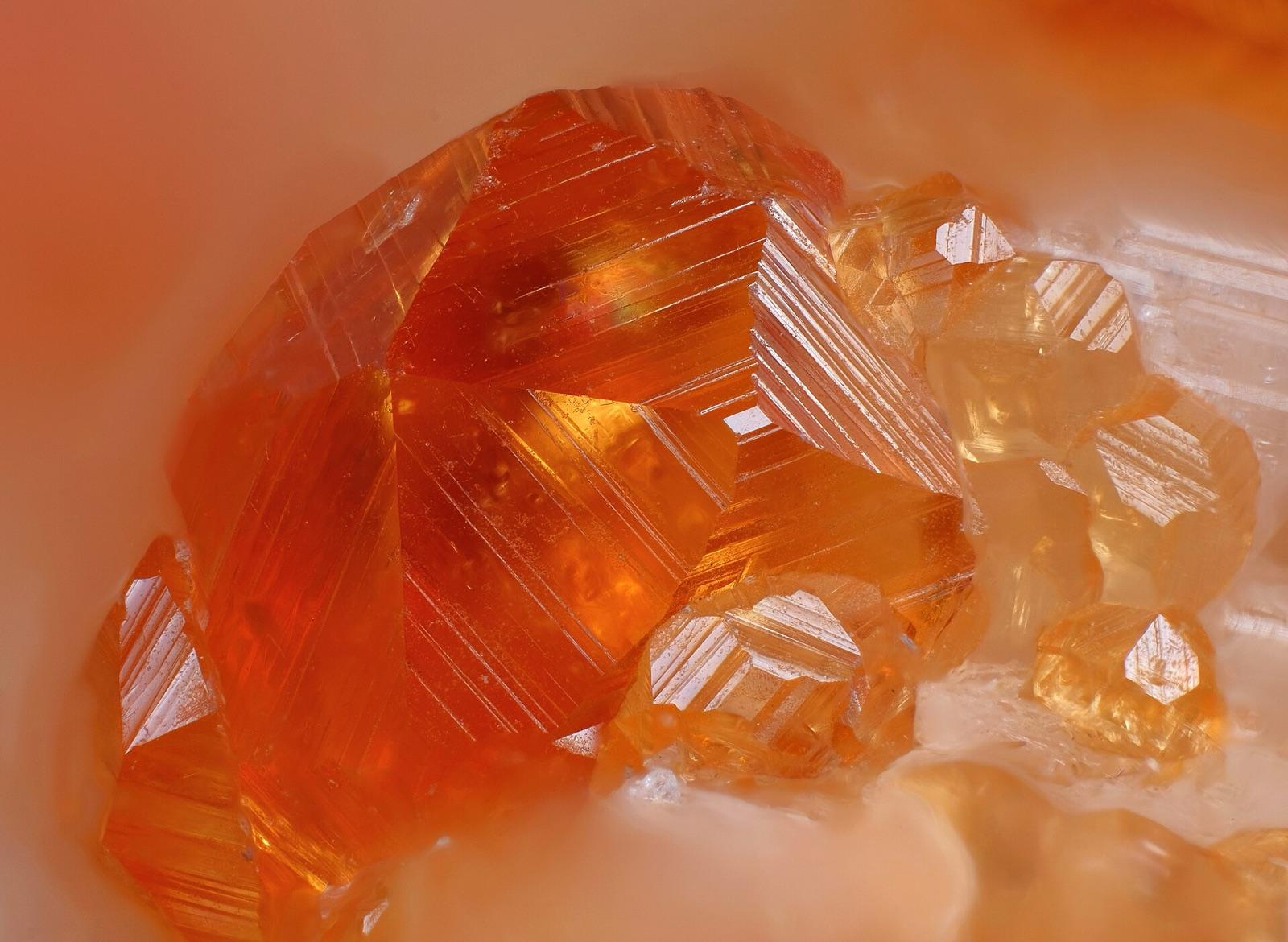 Close-up of orange spessartine garnet crystals with stepped faces, China