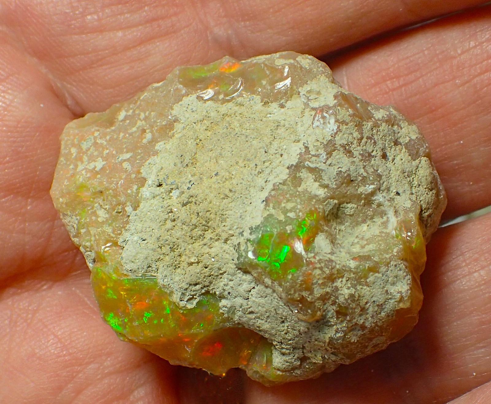 Rough Welo opal nodule from Ethiopia held in hand