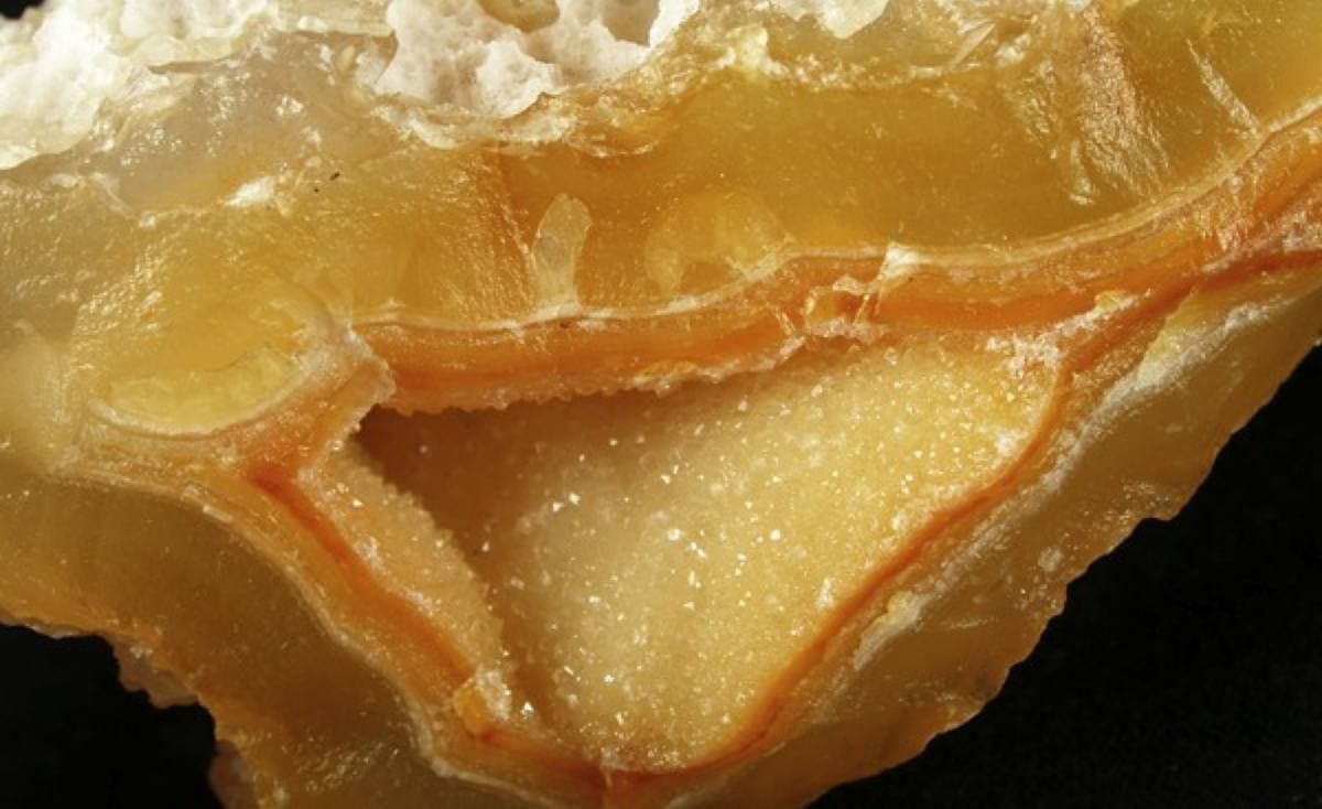 Yellow chalcedony showing waxy lustre and cavity lining