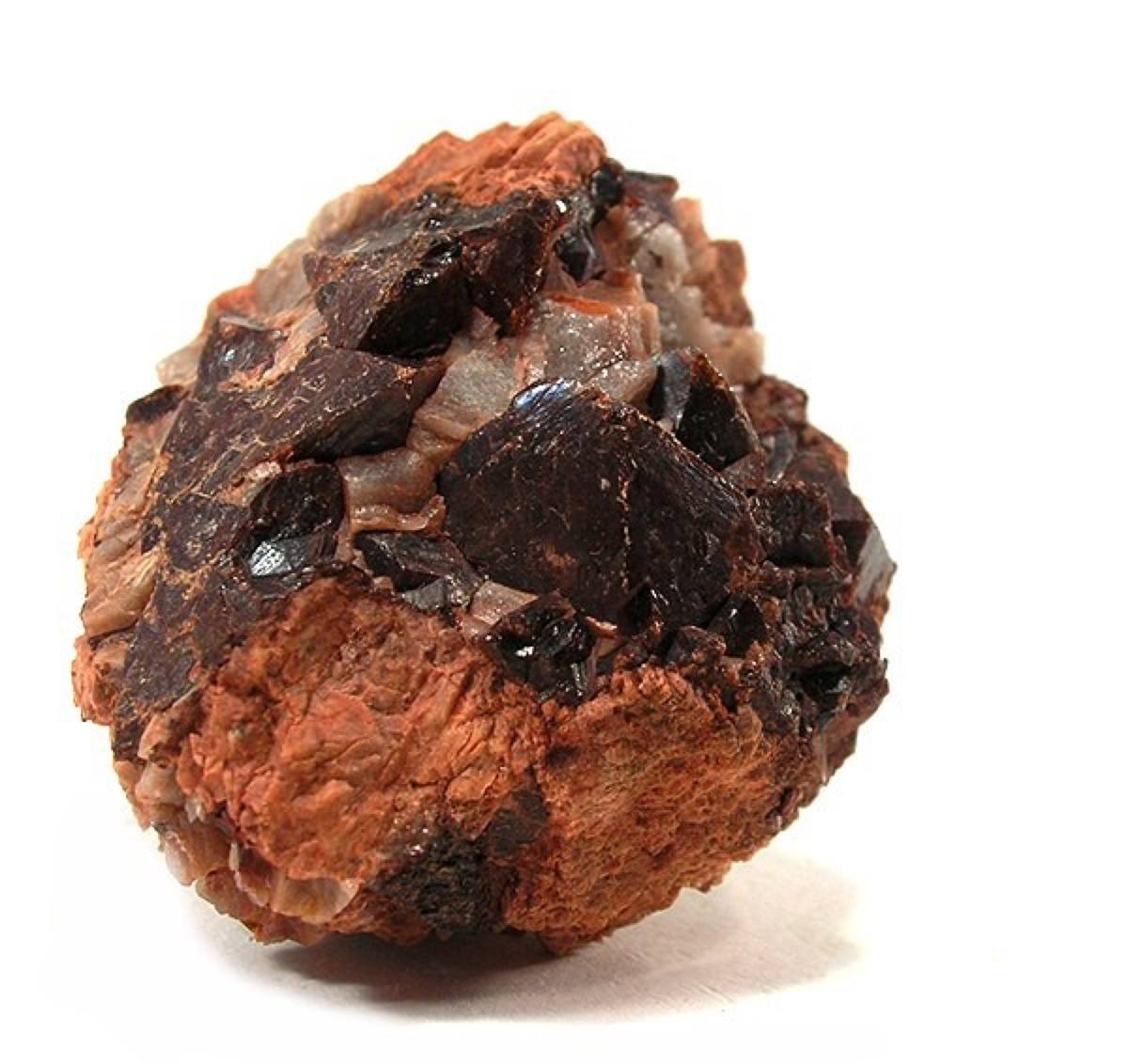 Brownish-red zircon crystals on pink feldspar, Wichita Mountains, Oklahoma